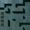 Abstract geometric facade in Oslo with tiles, grids, and shadows creating a minimalist design.